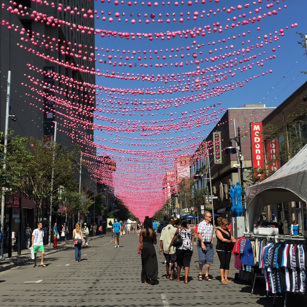 Pink lights hanging atop the length of Saint Catharine Street