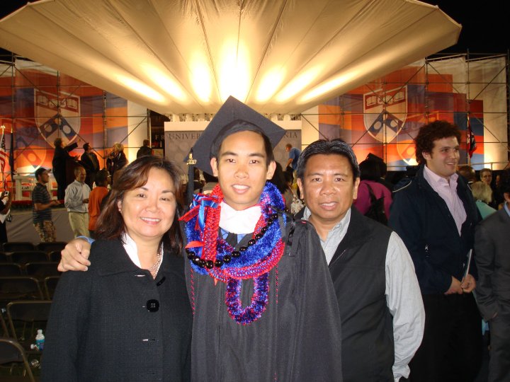 With my parents at my college graduation. 